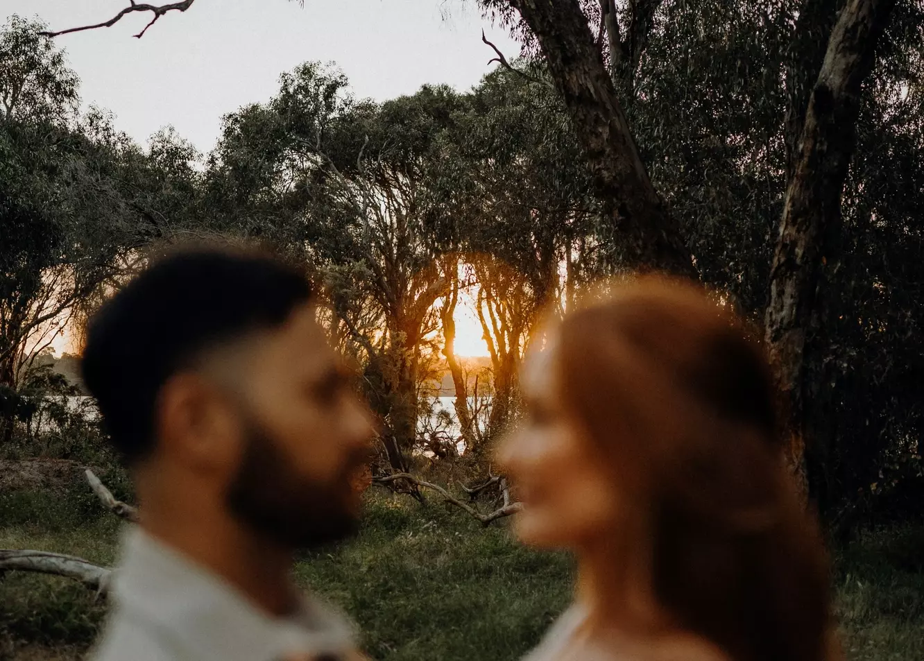 Enchanting Sunset Embrace: Couple's Romantic Woodland Moment
