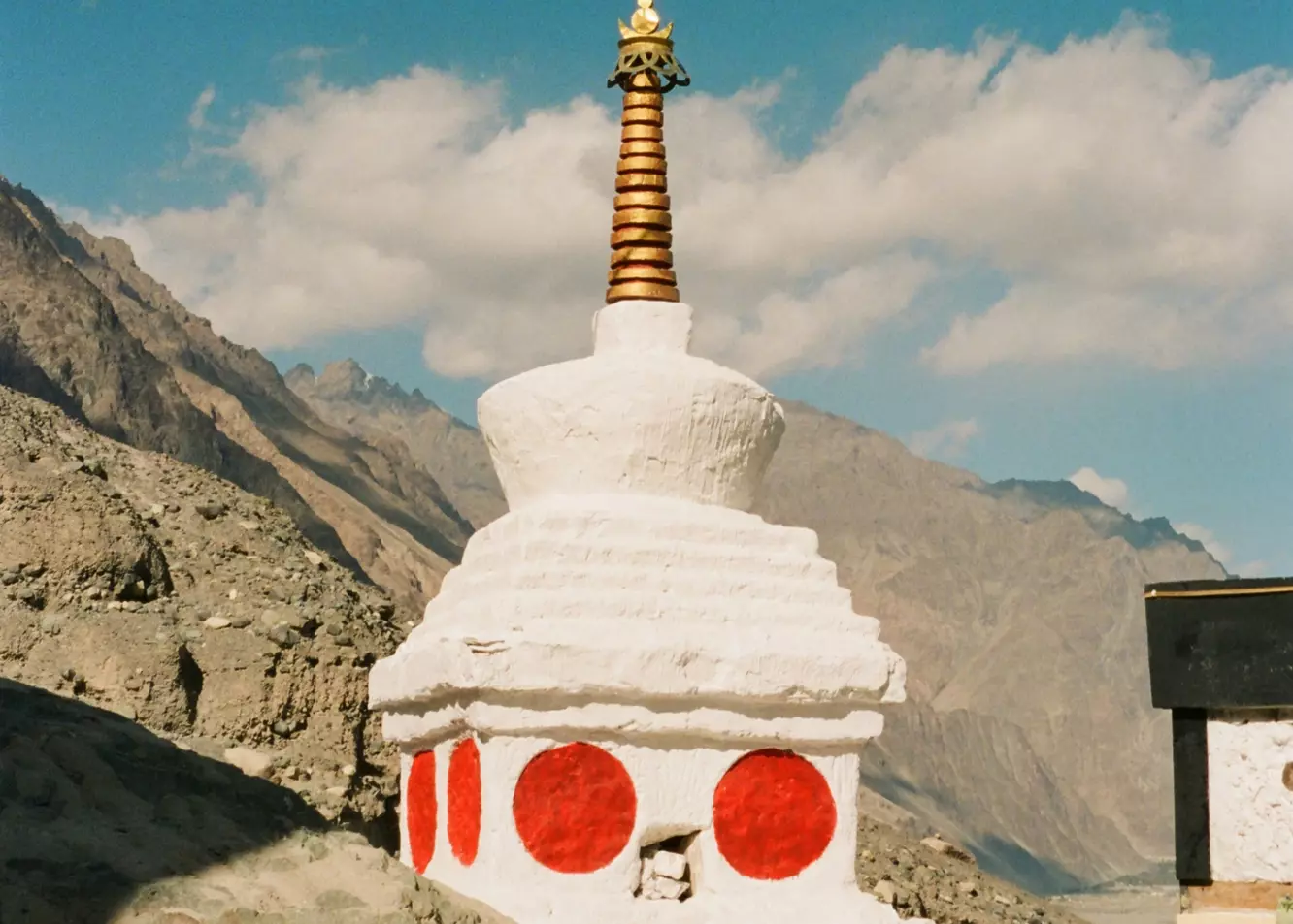 Ancient Stupa: White Buddhist Shrine on Rocky Hillside