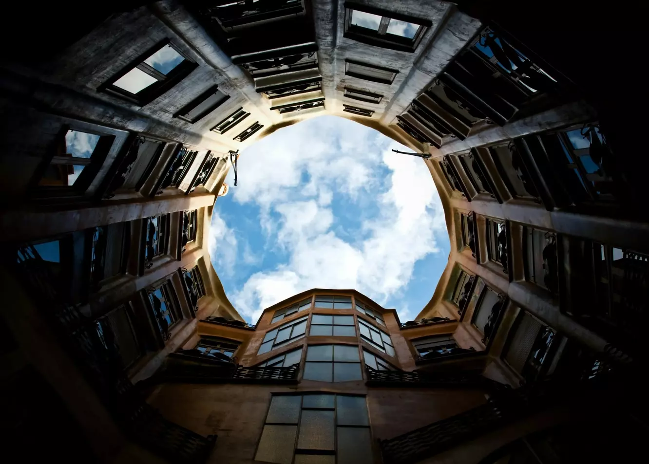 Dramatic Skyward Gaze: Circular Courtyard's Architectural Embrace