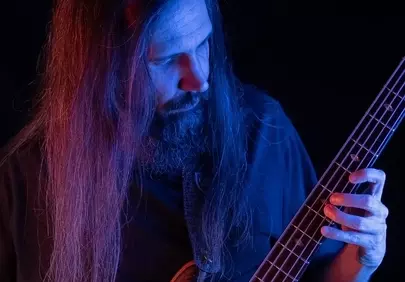 Dramatic Musician Portrait: Intense Bassist Under Neon Lights