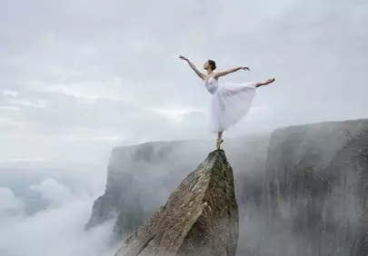 Breathtaking Ballet: Ethereal Dancer on Mountain Peak