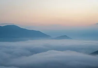 Misty Morning: Mountains Emerging from a Sea of Clouds
