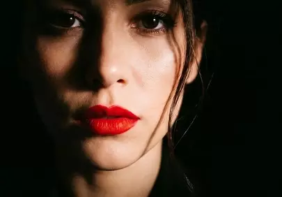 Striking Beauty: Dramatic Portrait with Bold Red Lips