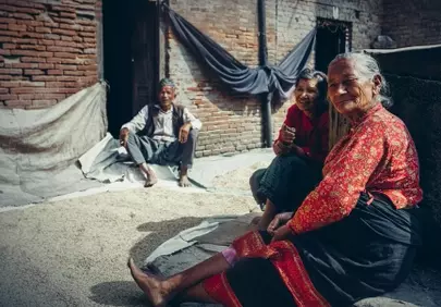 Authentic Glimpse: Serene Nepali Elders in a Rustic Village Setting