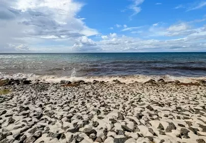 Serene Baltic Coastline: Rocky Beach Meets Endless Blue Sky