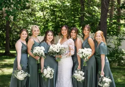 Stunning Bride and Bridesmaids in Sage Green Amidst Lush Garden