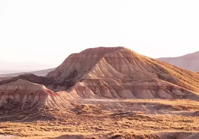 Breathtaking Desert Peaks Under Golden Sunset Hues