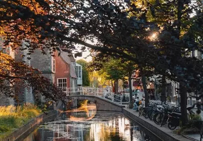 Enchanting Delft Sunset: Historic Canal Reflections