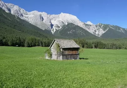 Breathtaking Alpine Retreat: Rustic Cabin Amidst Majestic Austrian Peaks