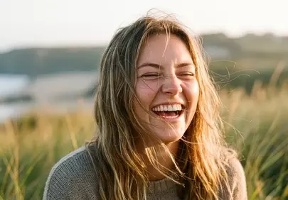 Radiant Joy: Happy Woman Laughing in Nature's Embrace