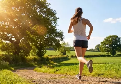 Radiant Outdoor Run: Woman Embracing Summer Nature