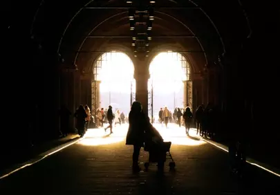 Dramatic Light: Silhouetted Figures in a Tunnel of Hope