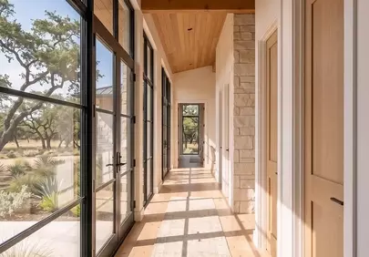 Sun-Drenched Modern Hallway: Elegant Design with Nature Views