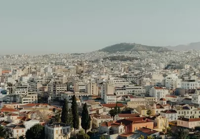 Breathtaking City Vista: Woman Admires Urban Landscape