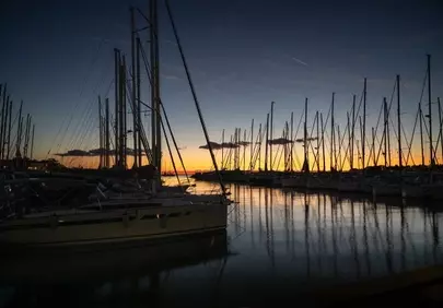 Stunning Sunset Serenity: Sailboats Reflecting Golden Hues