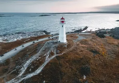 Dramatic Coastal Journey: Lighthouse at Sunset in Nova Scotia