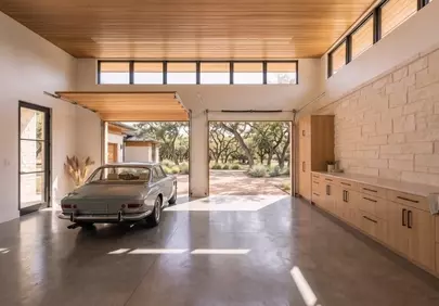 Stunning Modern Garage with Vintage Car and Scenic View