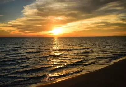 Breathtaking Tuscan Sunset Over the Tranquil Italian Coast