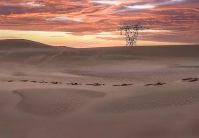 Dramatic Desert Sunset: Powering Through Remote Sand Dunes
