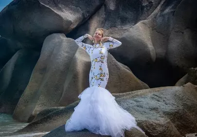 Stunning Bride Posing on Seychelles' Iconic Beach Boulders