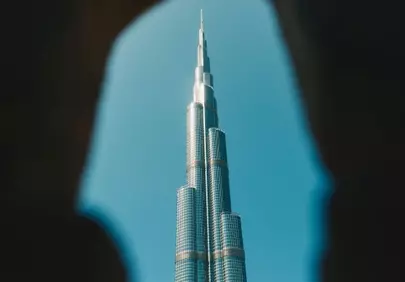 Dramatic Glimpse: Burj Khalifa Soaring Through a Dark Archway