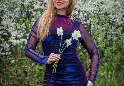 Stunning Spring Fashion: Woman Posing Amidst Blooming White Irises