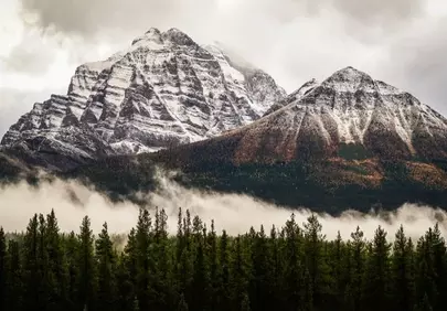 Majestic Rockies: Foggy Peaks & Autumn's Embrace