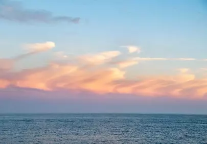 Breathtaking Pastel Sunset Over Tranquil Ocean Horizon