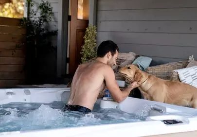 Relaxing Hot Tub Moment with Man and His Golden Retriever