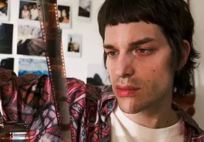 Nostalgic Gaze: Man Reviews Film Strip Memories