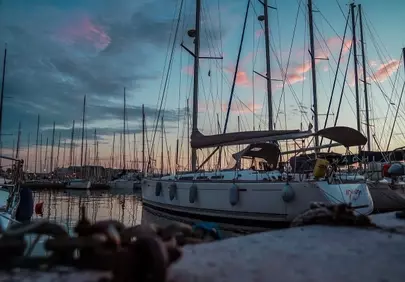 Breathtaking Italian Harbor Sunset: Yachts & Serene Reflections