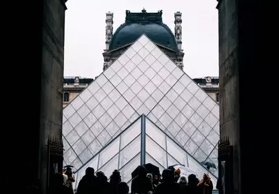 Iconic Louvre: Glimpse Through Parisian Archway
