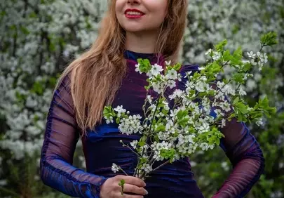 Enchanting Spring Blossom Portrait: Woman in Blooming Garden