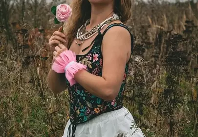 Enchanting Blonde in Floral Corset Amidst Autumn Fields