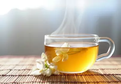 Steaming Herbal Tea with Fresh White Flowers for Tranquil Mornings