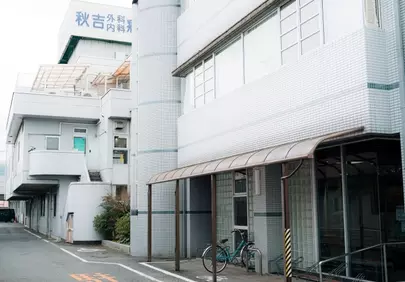 Urban Serenity: Japanese Street with White Architecture and Bicycle
