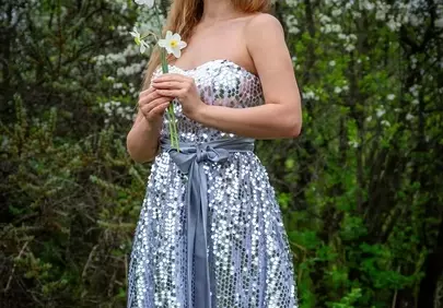 Radiant Spring Beauty: Sequin Dress Amidst Blossoms
