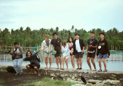 Joyful Group Portrait: Friends Posing by the Water