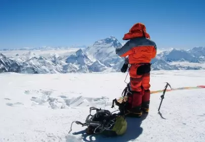 Breathtaking Summit: Solitude on a Majestic Snow-Capped Peak