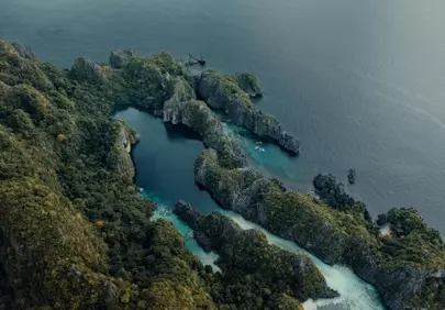 Dramatic Aerial View: Lush Green Islands Amidst Pristine Ocean