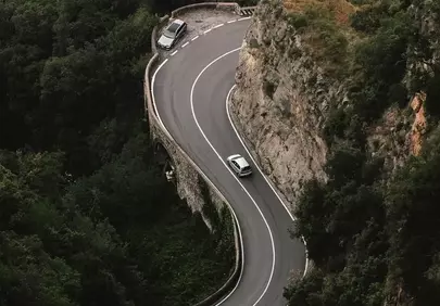 Breathtaking Mountain Road: A Serpentine Drive Through Nature's Embrace