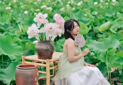 Serene Vietnamese Beauty Amidst Blooming Lotus Field