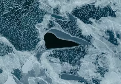 Stunning Abstract Ice Patterns with Dark Water Pockets