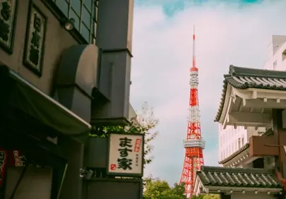 Iconic Tokyo Tower Peeking Through Traditional Japanese Architecture