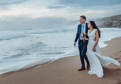 Romantic Beach Wedding: Couple's Seaside Stroll