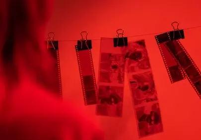 Vivid Red Darkroom: Film Negatives Drying