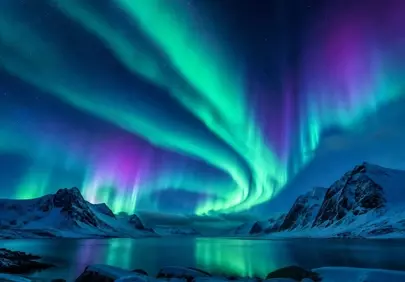 Breathtaking Aurora Over Snowy Mountains and Reflective Lake