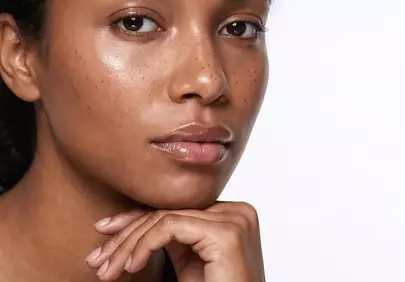 Stunning Natural Beauty: Freckled Woman's Captivating Gaze