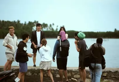 Joyful Group Gathered by the Water's Edge