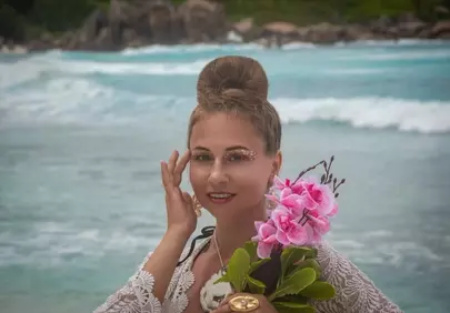 Enchanting Seychelles: Woman on Beach with Tropical Flowers